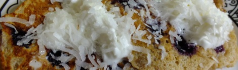 Photo of blueberry lemon pancakes with whipped cream and coconut